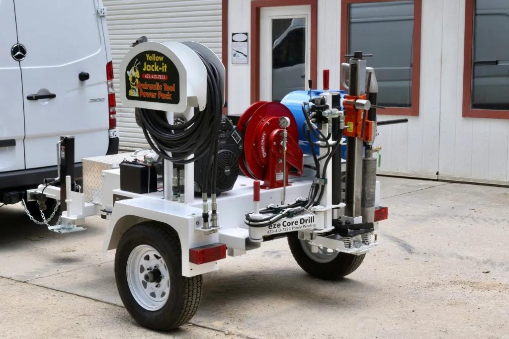 Yellow Jack-it hydraulic power pack trailer with drill