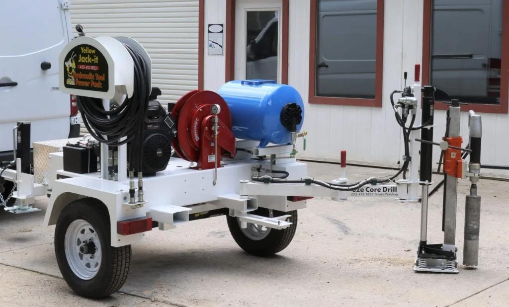 Full trailer setup with hydraulic hose reel and drill